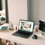 A laptop on a desk in a bright room