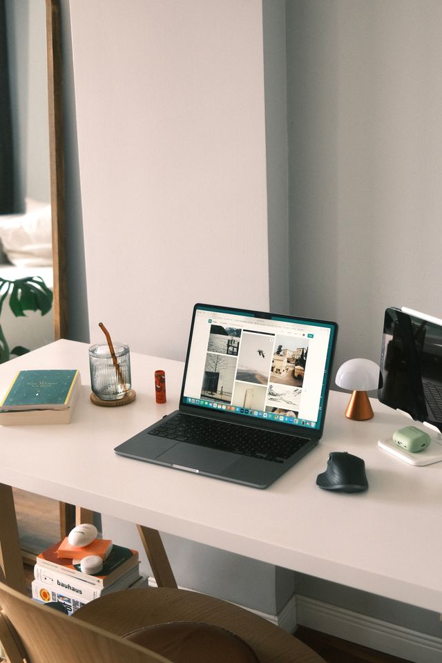 A laptop on a desk in a bright room